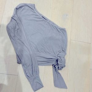 Small, one shoulder, long sleeve, grey crop top from Revolve: Michael Lauren